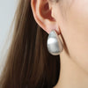 Fashionable Unisex Casual Geometric Hollow Water Drop Design Frosted Goldplated Titanium Steel Earrings