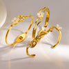 Flowerembellished Diamondstudded 18K Goldplated Stainless Steel Bracelet With Light Luxury Style