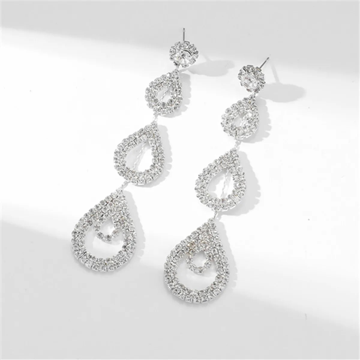 Glam Shiny Water Droplets Rhinestone Plating Hollow Out Inlay Rhinestones Silver Plated Women'S Drop Earrings