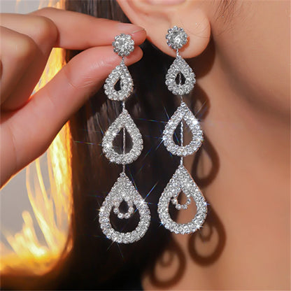 Glam Shiny Water Droplets Rhinestone Plating Hollow Out Inlay Rhinestones Silver Plated Women'S Drop Earrings