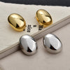 Gold Plated Copper Geometric Oval Sphere Statement Earrings With Glossy Polished Eggshell Design For Women