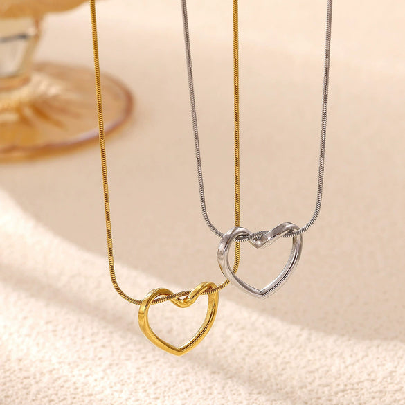 Gold Plated Titanium Steel Hollow Heart Pendant Snake Chain Necklace For Women Minimalist Versatile Jewelry Design