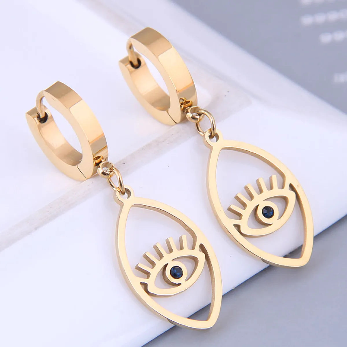 Korean Fashion Sweet Ol Devil Eye Titanium Steel Earrings Wholesale