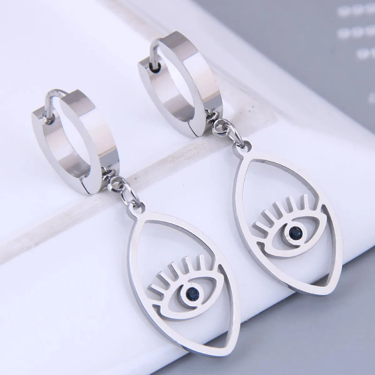 Korean Fashion Sweet Ol Devil Eye Titanium Steel Earrings Wholesale