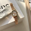 Ladies Casual Retro Quartz Watch Alloy Case Imitation Leather Strap Rose Gold Buckle Round Dial Printed Logo