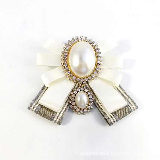 Lady Bow Knot Cloth Plating Inlay Artificial Pearls Artificial Diamond Women'S Brooches