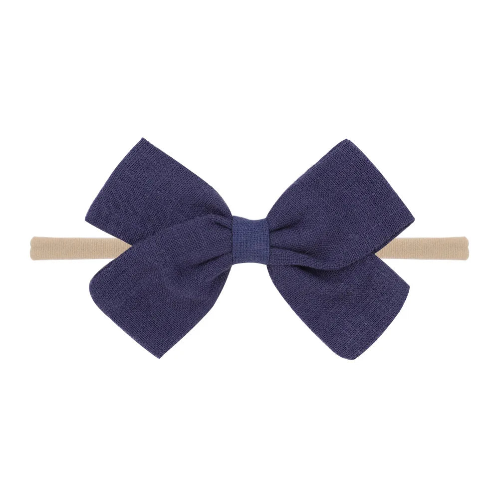 Nihaojewelry Cute Children'S Cotton And Linen Fabric Bow Hair Band Wholesale Jewelry