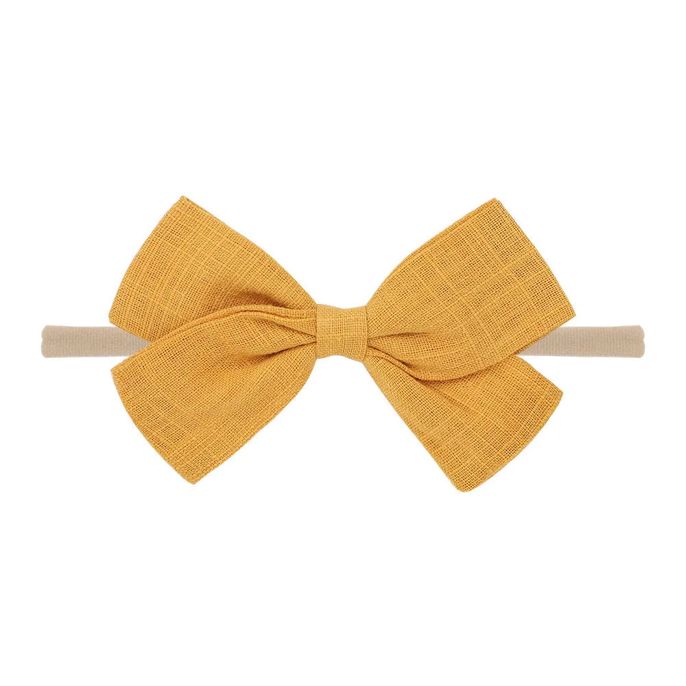 Nihaojewelry Cute Children'S Cotton And Linen Fabric Bow Hair Band Wholesale Jewelry