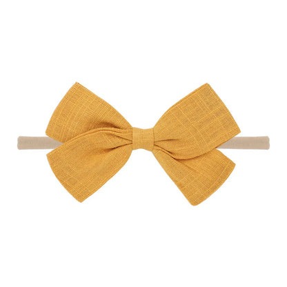 Nihaojewelry Cute Children'S Cotton And Linen Fabric Bow Hair Band Wholesale Jewelry