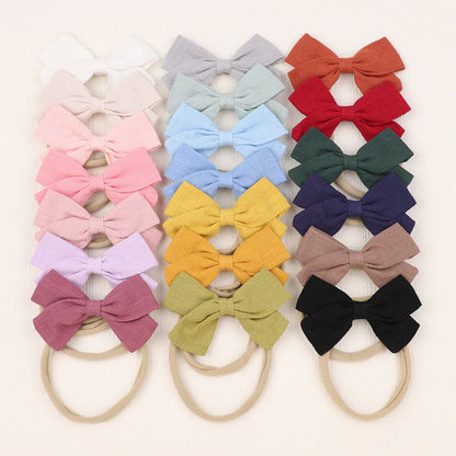 Nihaojewelry Cute Children'S Cotton And Linen Fabric Bow Hair Band Wholesale Jewelry