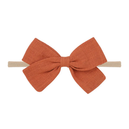 Nihaojewelry Cute Children'S Cotton And Linen Fabric Bow Hair Band Wholesale Jewelry