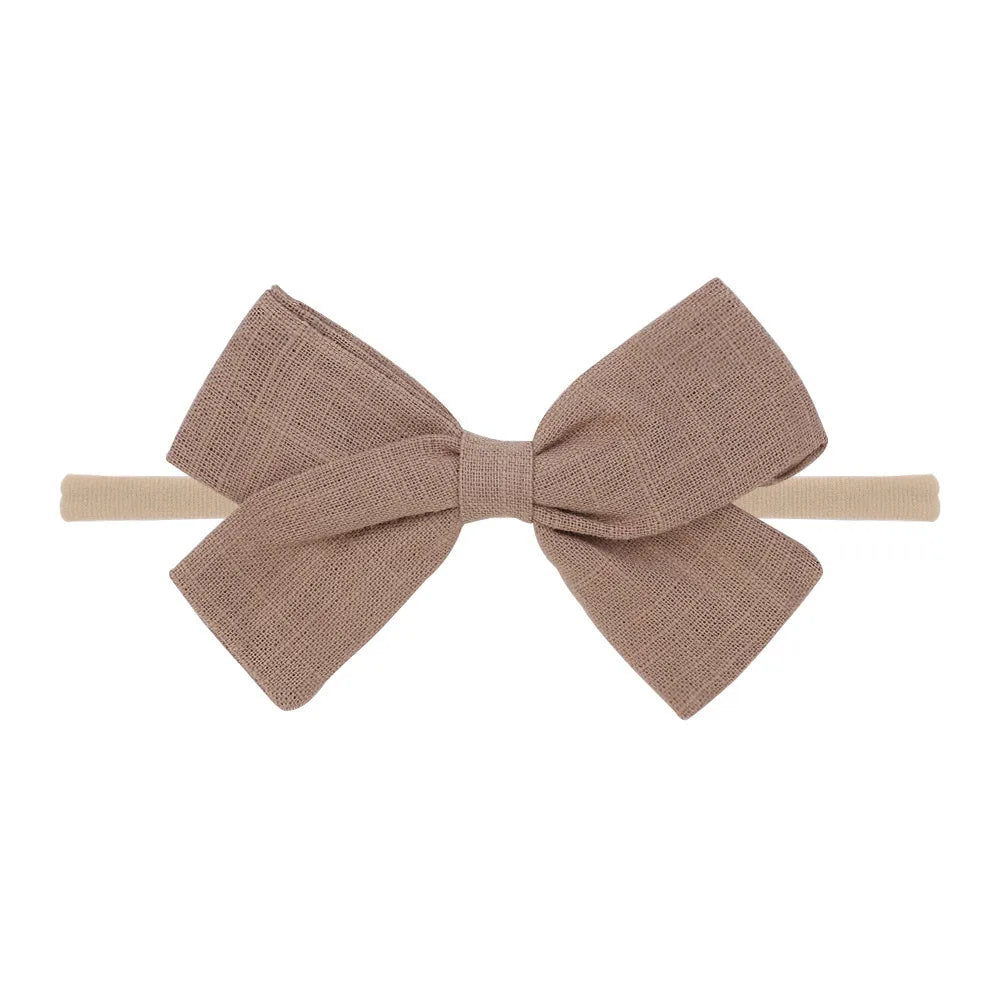 Nihaojewelry Cute Children'S Cotton And Linen Fabric Bow Hair Band Wholesale Jewelry