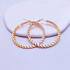 Oversized Twisted Hoop Earrings In Metal With Electroplated Finish And Exaggerated Street Style Design