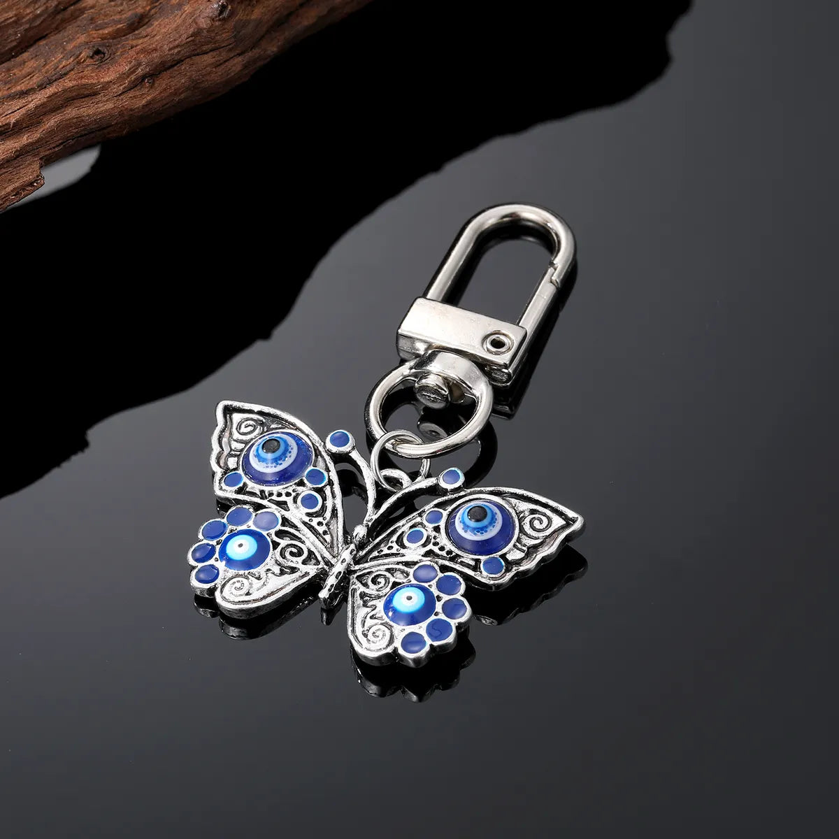 Retro Devil'S Eye Butterfly Alloy Women'S Earrings Keychain Necklace