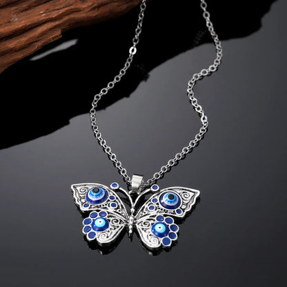 Retro Devil'S Eye Butterfly Alloy Women'S Earrings Keychain Necklace