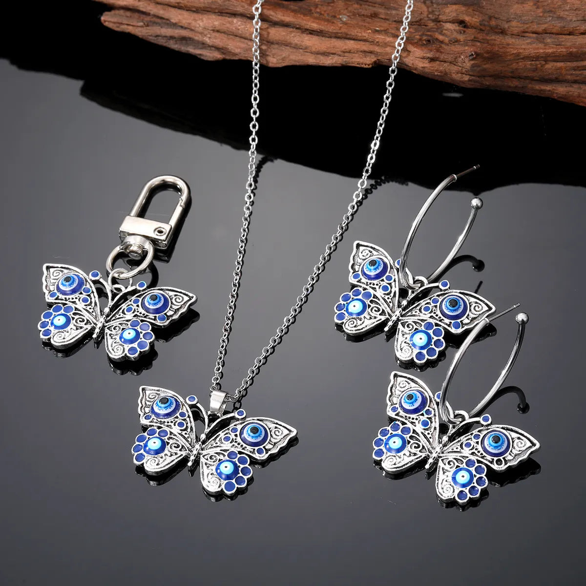 Retro Devil'S Eye Butterfly Alloy Women'S Earrings Keychain Necklace