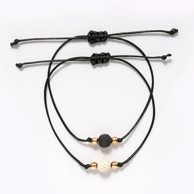 Simple Style Classic Style Solid Color Volcanic Rock Rope Knitting Unisex Bracelets