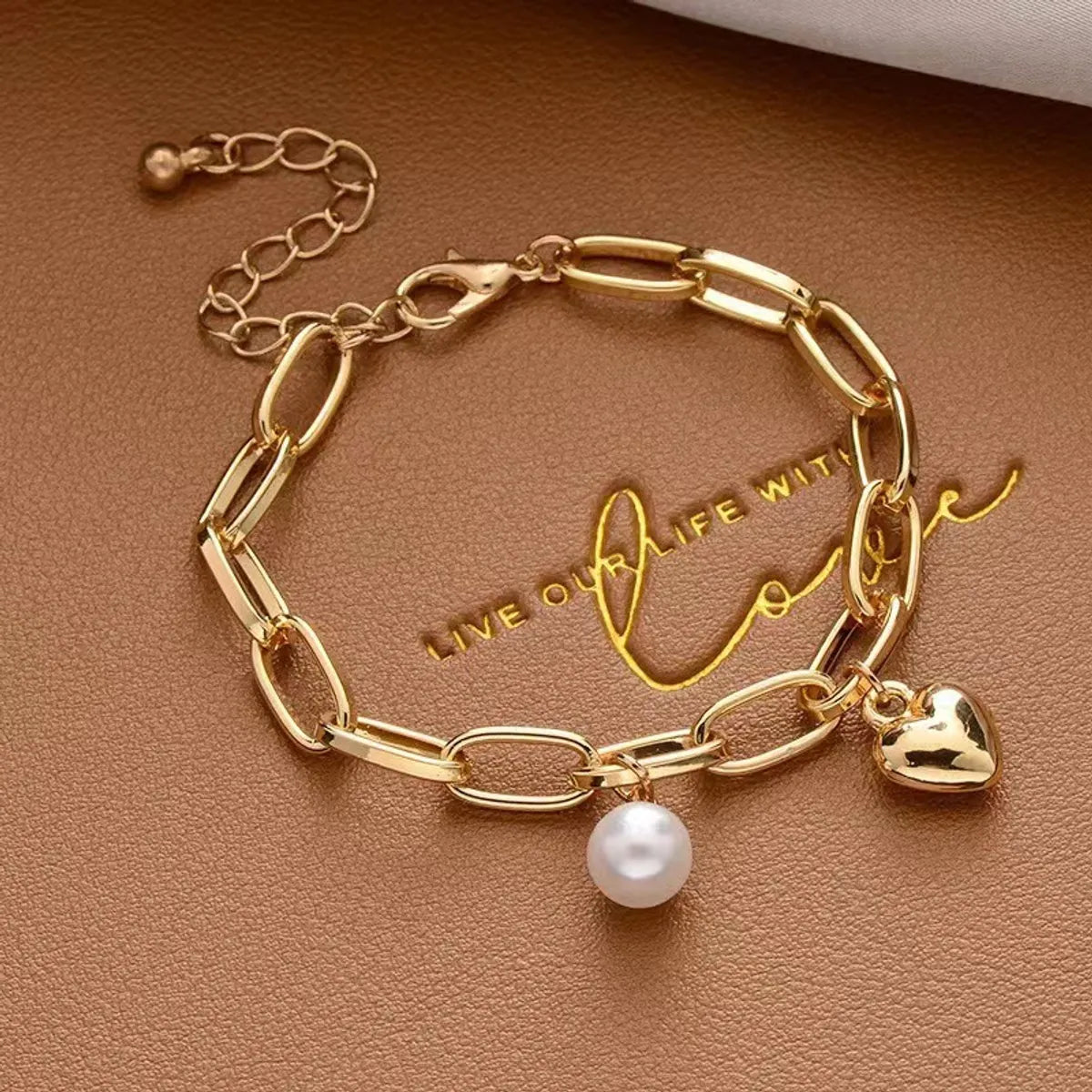 Simple Style Cross Heart Shape Artificial Pearl Alloy Plating Gold Plated Women'S Bracelets