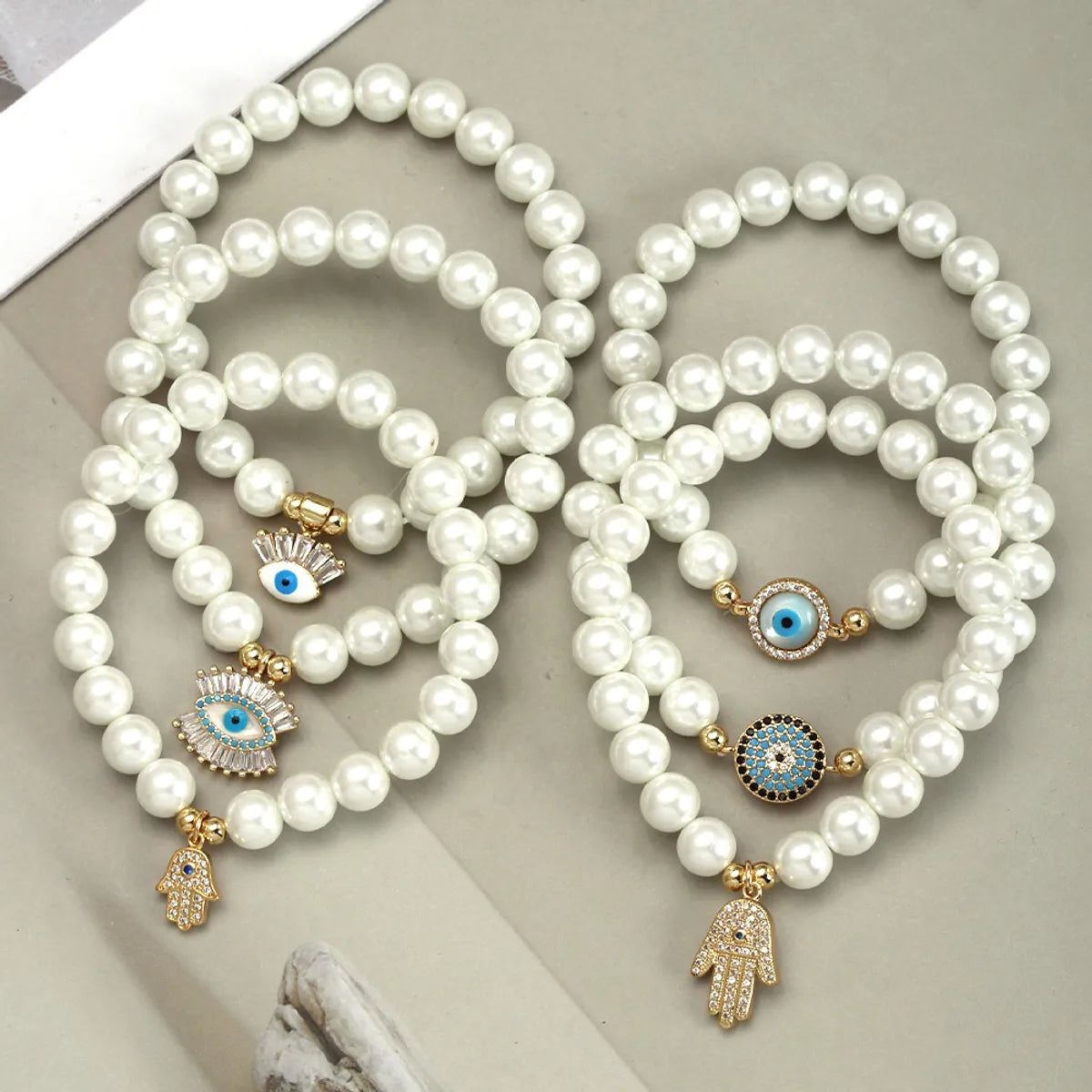 Simple Style Devil'S Eye Hand Of Fatima Artificial Pearl Glass Copper Wholesale Bracelets