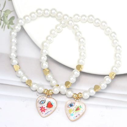 Simple Style Devil'S Eye Heart Shape Imitation Pearl Alloy Wholesale Bracelets