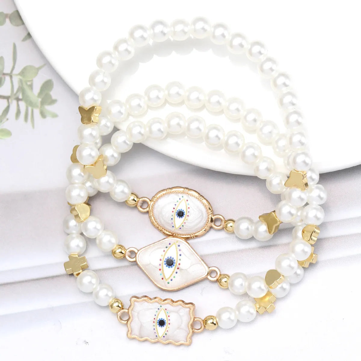 Simple Style Devil'S Eye Heart Shape Imitation Pearl Alloy Wholesale Bracelets