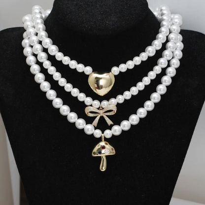 Simple Style Geometric Heart Shape Bow Knot Zircon Imitation Pearl Copper Wholesale Necklace