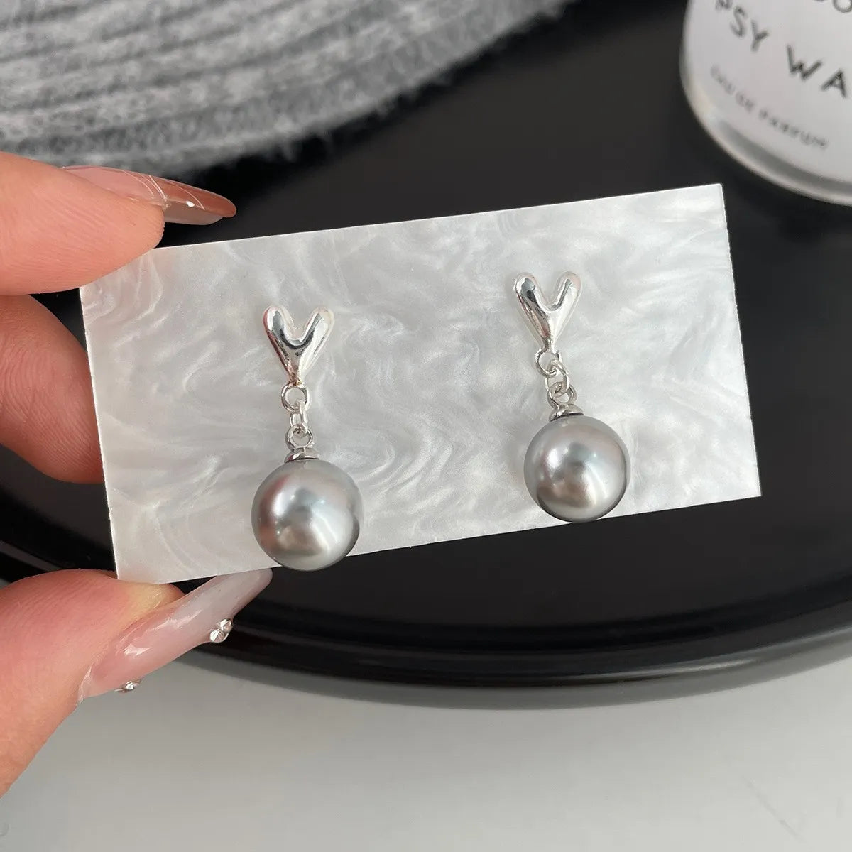 Simple Style Pearl Alloy Stoving Varnish Artificial Pearls Women'S Ear Studs 1 Pair