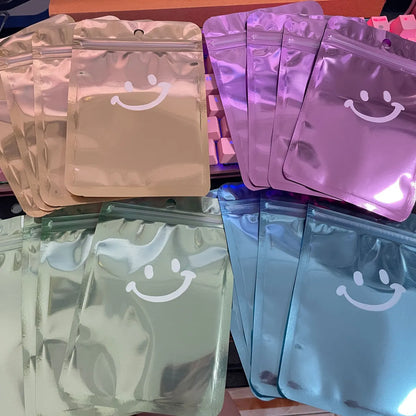 Simple Style Smile Face Solid Color Aluminum Foil Jewelry Packaging Bags