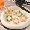 Stainless Steel Flower Patterned Pvd Electroplated Antique Style Women's Pearl Inlaid Garland Earrings