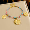 Stainless Steel Goldplated Flower Round Pendant Braided Rope Women's Bracelet With Electroplating