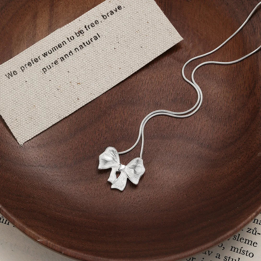 Sterling Silver Hollow Out Bow Knot Pendant Necklace