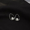Sterling Silver Hollow Teardrop Earrings With Shell Bead Details And Ear Hook Design For Women