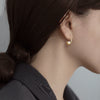 Sterling Silver Hollow Teardrop Earrings With Shell Bead Details And Ear Hook Design For Women