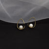 Sterling Silver Hollow Teardrop Earrings With Shell Bead Details And Ear Hook Design For Women
