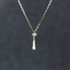 Sterling Silver Water Drop Necklace Plated With 14K Gold Vertical Strips Inlaid With Diamonds