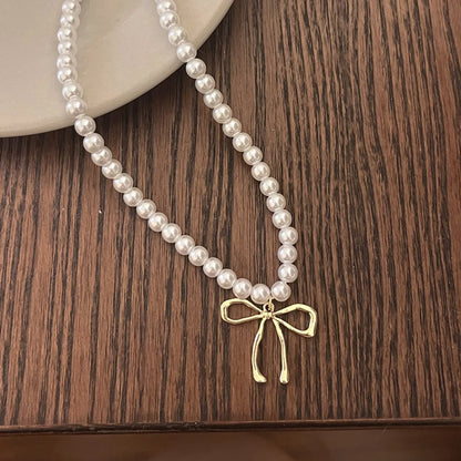 Sweet Bow Knot Imitation Pearl Alloy Wholesale Pendant Necklace