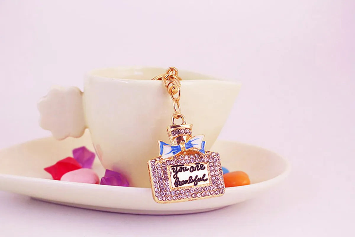 Sweet Perfume Bottle Zinc Alloy Plating Inlay Rhinestones Women'S Bag Pendant Keychain