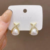 Sweet Star Flower Bow Knot Alloy Inlay Artificial Pearls Rhinestones Women'S Earrings 1 Pair