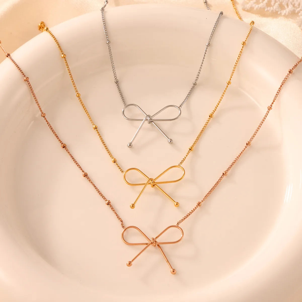 Titanium Steel 18K Gold Plated Casual Simple Style Commute Plating Bow Knot Bracelets Necklace