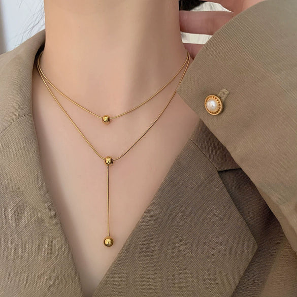 Titanium Steel Doublelayer Stacked Tassel Ball Light Luxury Necklace With Drop Shape And Snake Bone Chain