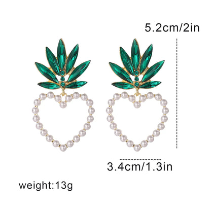 Vacation Modern Style Artistic Fruit Heart Shape Pineapple Alloy Beaded Hollow Out Inlay Artificial Crystal Artificial Pearls Women'S Ear Studs