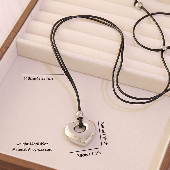 Wholesale Adjustable Sweater Chain Necklace With Geometric And Heart Shape Alloy Pendant And Black Braided Rope