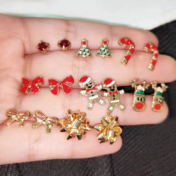 Wholesale Alloy Christmas Earrings With Elk And Cartoon Characters Electroplating Design