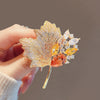 Wholesale Alloy Crystal Retro Hollow Maple Leaf Flower Brooch For Women With Electroplating