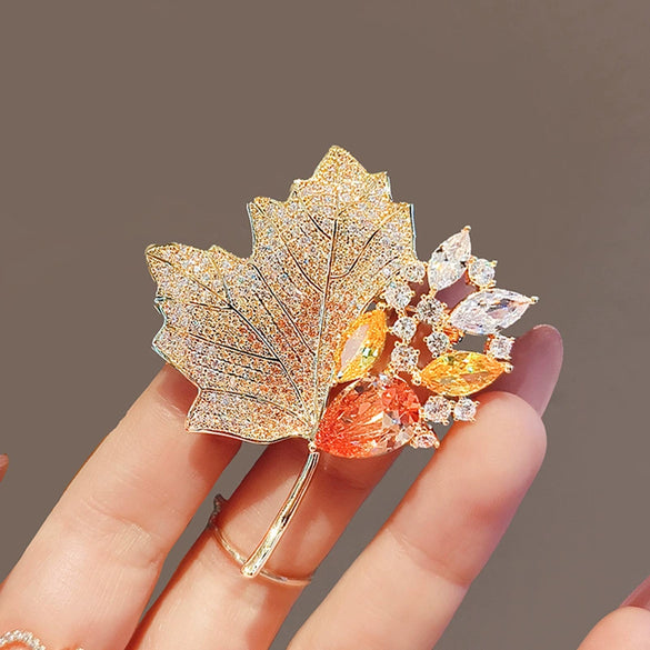 Wholesale Alloy Crystal Retro Hollow Maple Leaf Flower Brooch For Women With Electroplating
