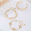 Wholesale Alloy Electroplated Exaggerated Geometric Hollow Fourleaf Clover Bracelet And Adjustable Ring Set For Women