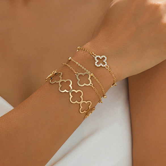 Wholesale Alloy Electroplated Exaggerated Geometric Hollow Fourleaf Clover Bracelet And Adjustable Ring Set For Women