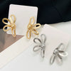 Wholesale Alloy Electroplated Geometric Flower Hollow Women's Earrings With Retro Style