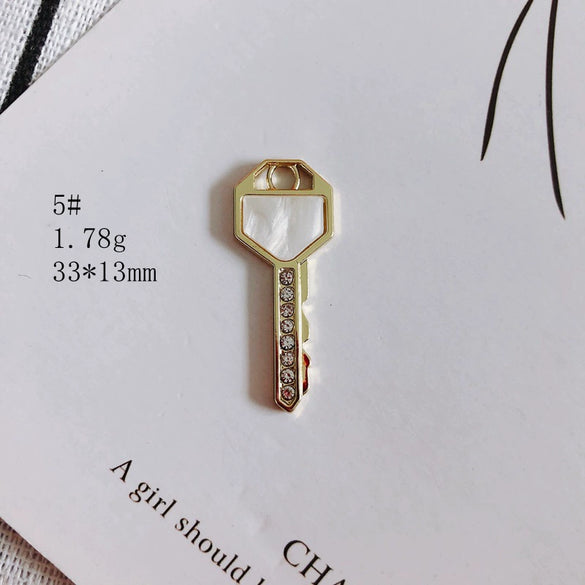 Wholesale Alloy Electroplating Key Love Lock Inlaid Pearl Hollow Small Pendant Accessories