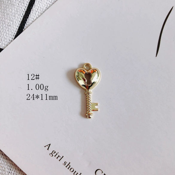 Wholesale Alloy Electroplating Key Love Lock Inlaid Pearl Hollow Small Pendant Accessories
